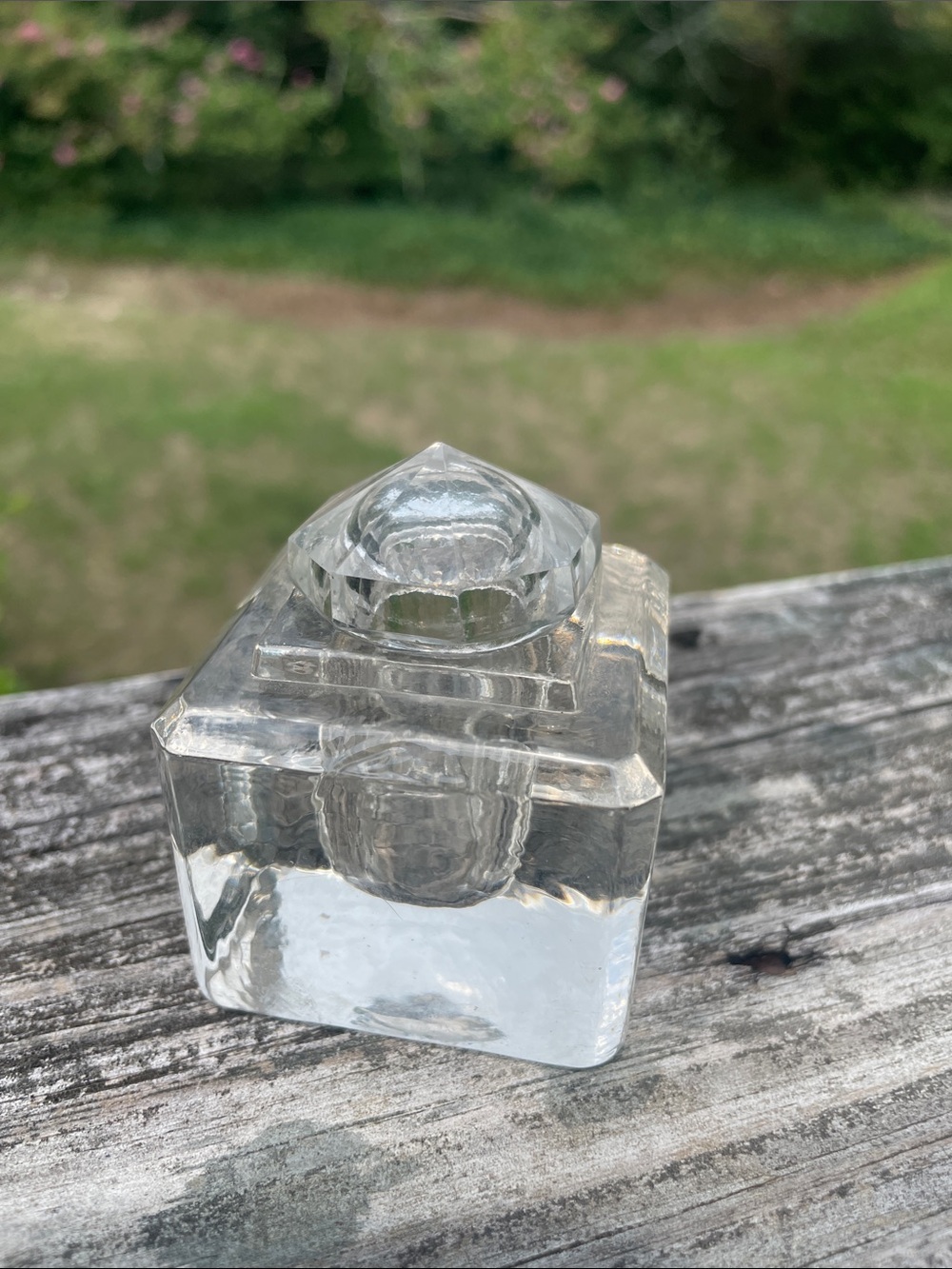 Antique glass inkwell with lid. Minor chips on underside of lid as shown.